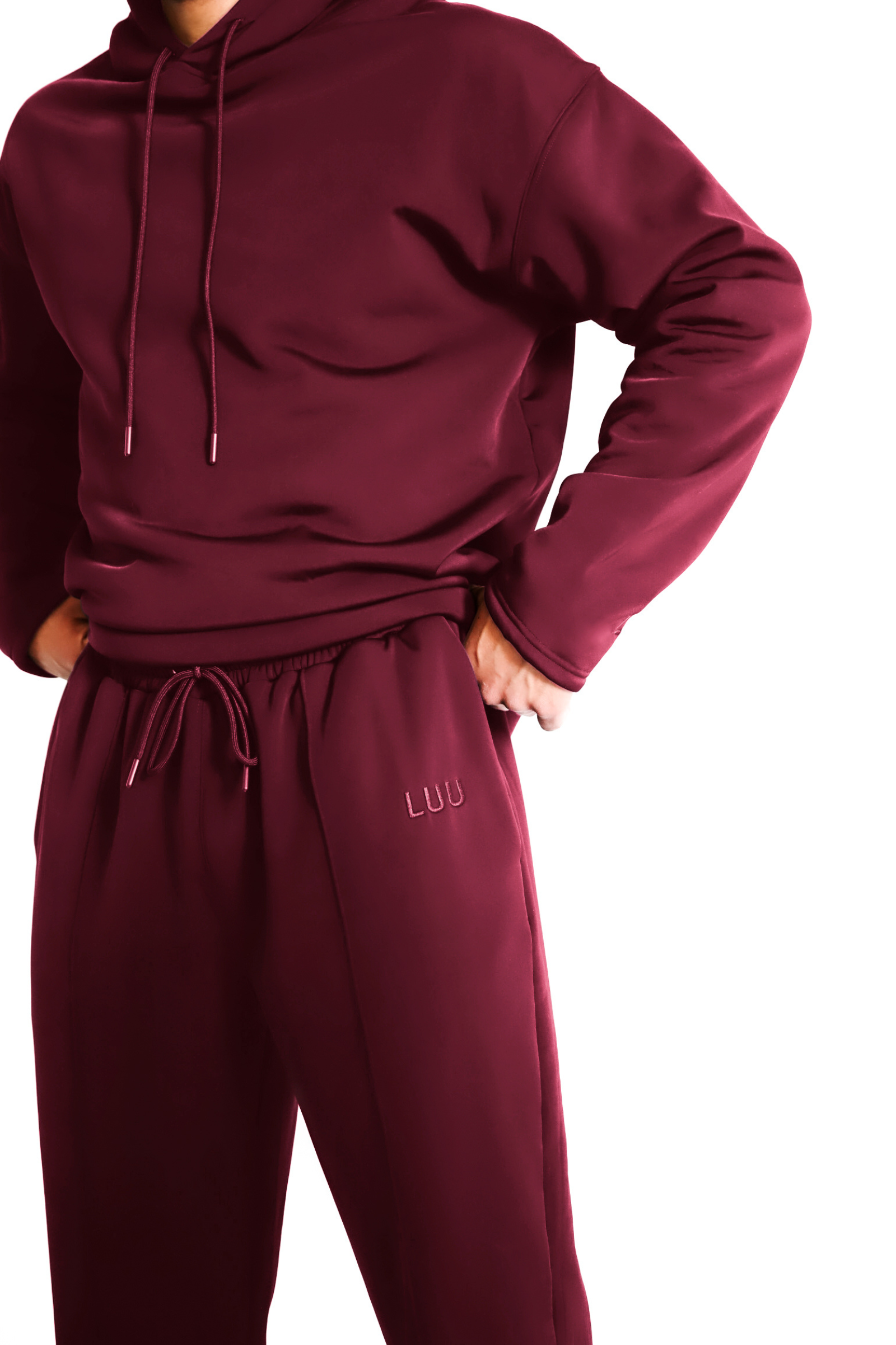 Maroon tracksuit with 'LUU' branding on a white background